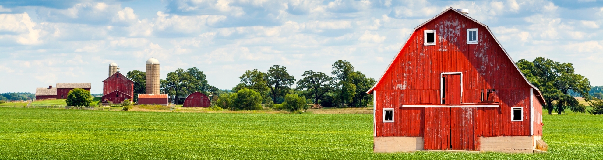 Traditional American Red Barn With Blue Sky